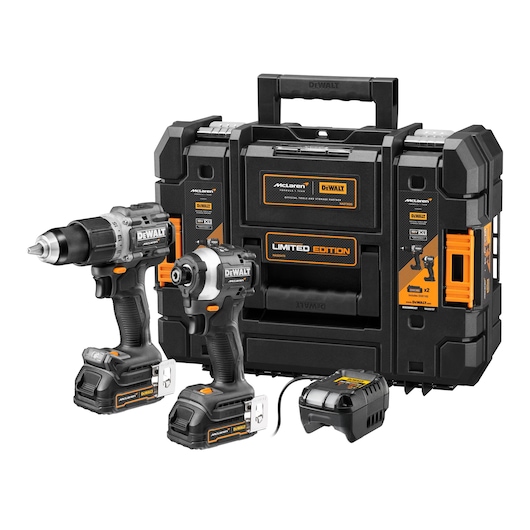 DEWALT limited edition tool set with two cordless power tools, a battery charger, and a sturdy black carrying case featuring orange accents and McLaren branding.