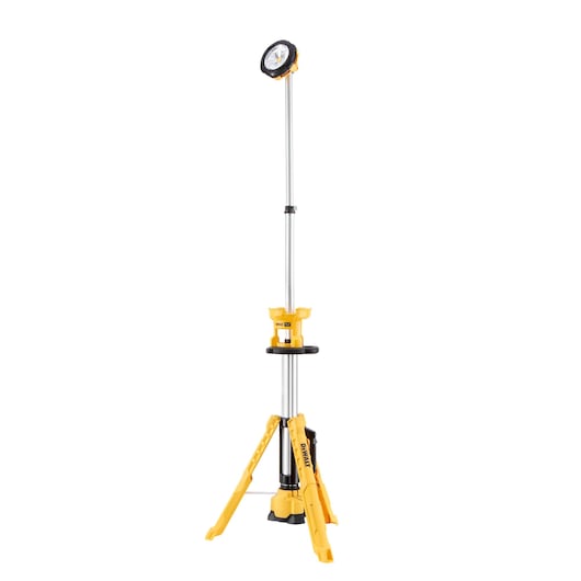 A DEWALT portable LED work light standing on a yellow tripod with adjustable height and extendable pole.