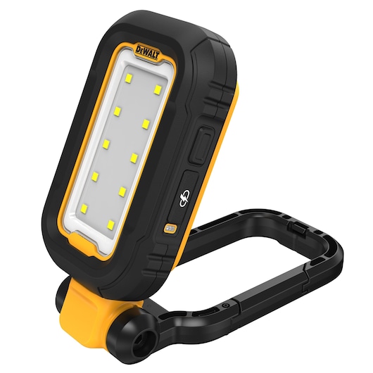 A DEWALT portable LED work light with a black and yellow casing, featuring a rectangular light panel with multiple LEDs and a foldable stand.