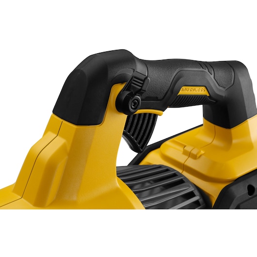Close-up of a DEWALT power tool handle, featuring a yellow and black ergonomic grip and trigger.