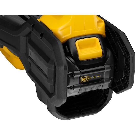Close-up of DEWALT power tool with visible battery indicator and rugged yellow and black casing.