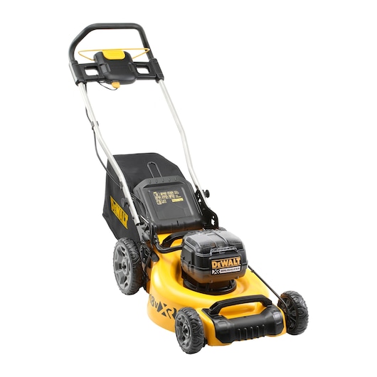 A DEWALT cordless lawn mower with a yellow and black design, featuring large rear wheels, a black grass collection bag, and a brushless motor.