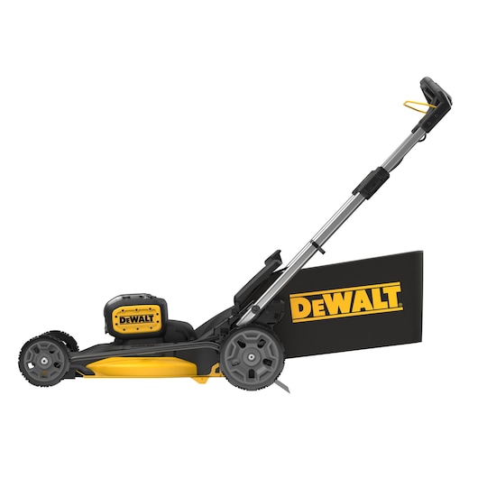 Side view of a black and yellow DEWALT cordless lawn mower with grass collection bag.