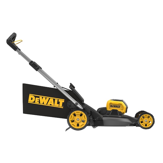 Side view of a DEWALT cordless lawn mower with yellow wheels and handle, grass bag attached.