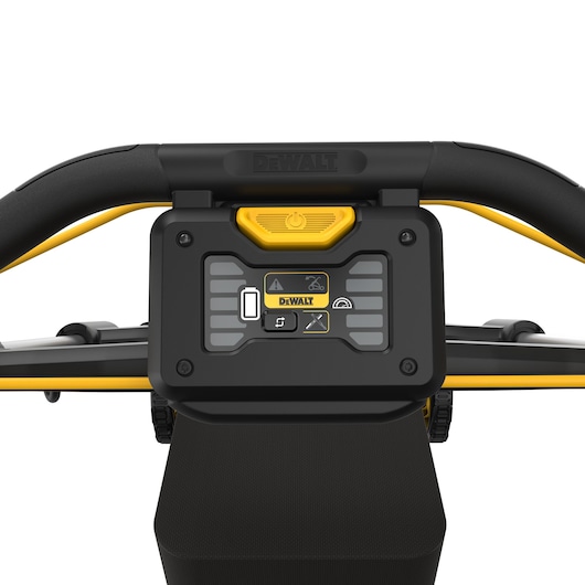 Close-up of DEWALT DCMWP500N mower control panel with buttons and handlebar visible.