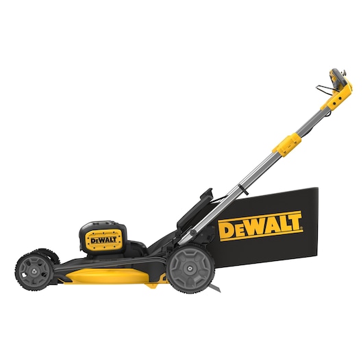 Side view of a DEWALT cordless lawn mower, black and yellow, with rear grass bag attached.