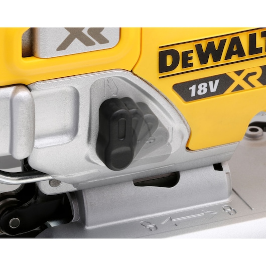 Close-up of DEWALT 18V XR power tool showing switch and brand logo detail.