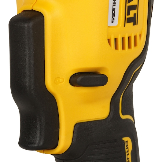 Close-up of a yellow and black DEWALT tool handle with a switch and part of the logo visible.