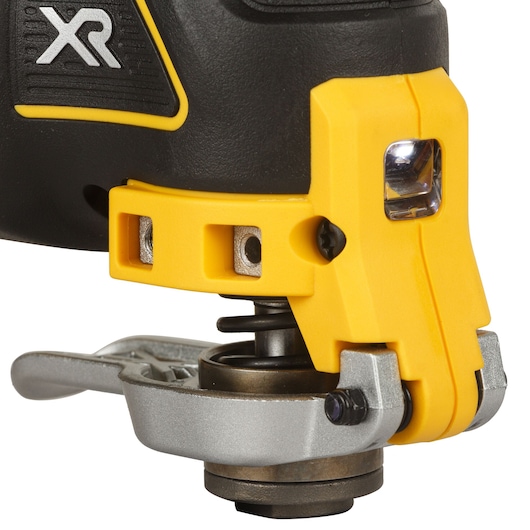 Closeup of a DEWALT oscillating tool with yellow and metal parts, showing the XR logo and a built-in LED light.