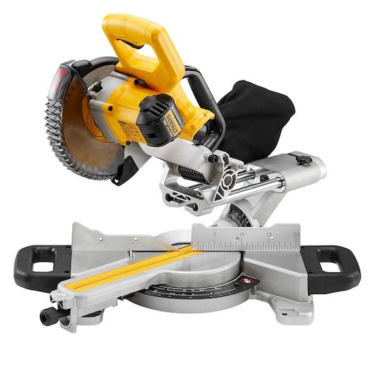 DEWALT DCS365N cordless sliding mitre saw with yellow and black detailing, featuring a circular saw blade, measuring scale, and dust collection bag on a sturdy base.