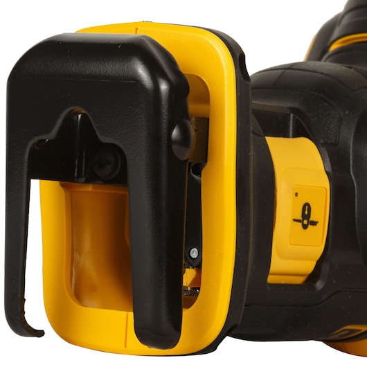 Close-up of a DEWALT power tool with yellow and black details, showing the blade lock mechanism.