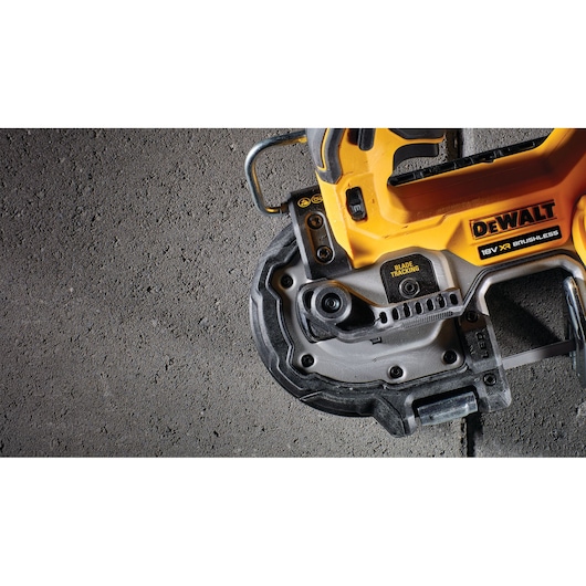 Close-up of a DEWALT 18V XR brushless tool on a concrete surface.