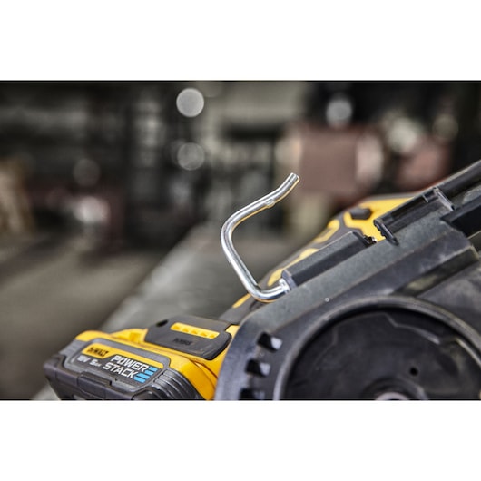 Close-up of DEWALT tool showing metal hook and Power Stack battery detail.