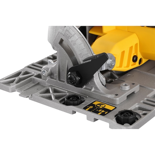 Close-up of DEWALT DCS572NT circular saw base showing bevel adjustment and sturdy metal construction.