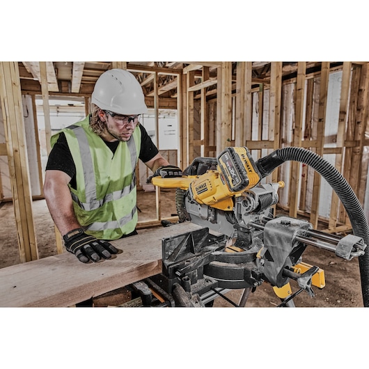 DEWALT DCS781X2-QW, DCS781X2 saw used by worker in construction site. Product in Photography category.