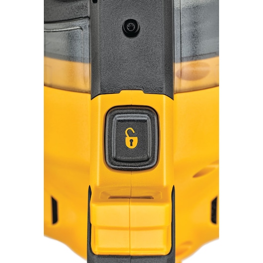 Close-up view of a yellow and black DEWALT product featuring a lock button with an open padlock symbol.