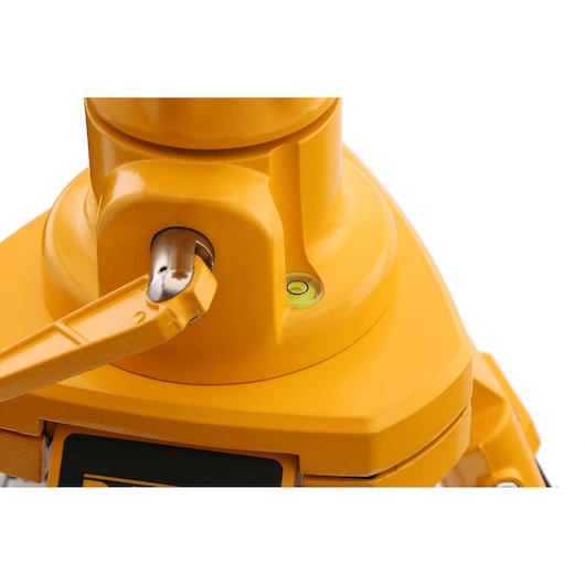 Close-up of a DEWALT yellow photography accessory with a bubble level and metal adjustment knob.