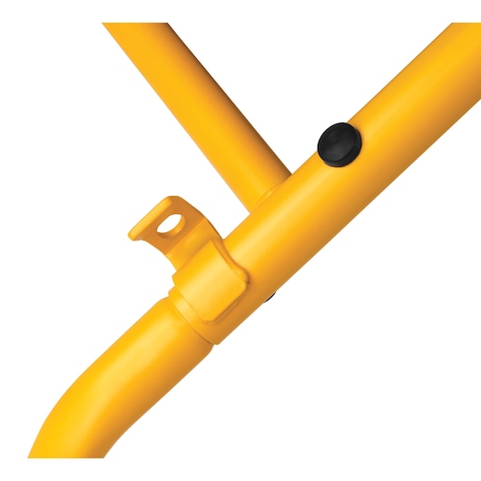 Close-up of a yellow DEWALT metal frame joint with a black button and mounting bracket.