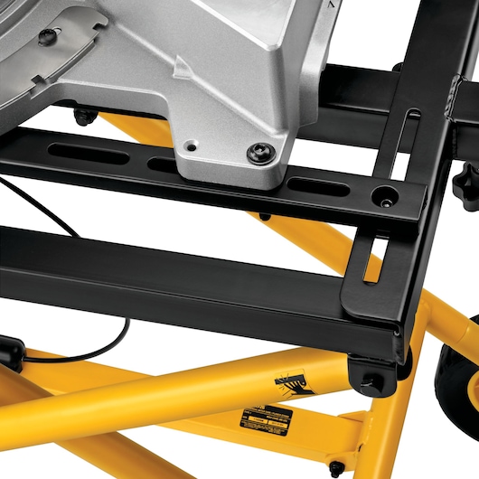Closeup of DEWALT DE7260 saw stand with yellow frame and black mounting bracket.
