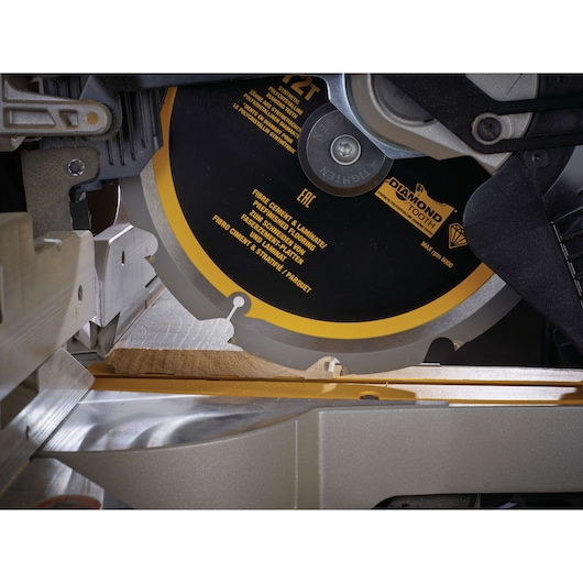 Close-up of a DEWALT DT1474 saw blade cutting fiber cement board.