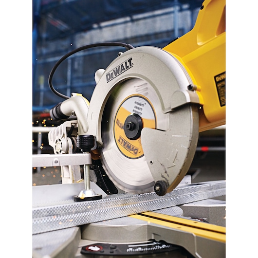 DEWALT circular saw cutting metal material, with sparks flying during operation.