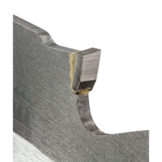Close-up of a metal saw blade tooth showing its sharp edge and joining material.