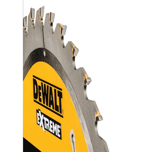 Close-up of a DEWALT Extreme circular saw blade with visible teeth and yellow branding.