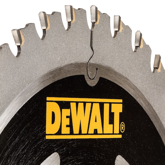 Close-up of a DEWALT circular saw blade showing sharp teeth and branded logo.