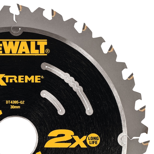 Close-up of a DEWALT DT4395 circular saw blade with sharp metal teeth and product markings on the surface.