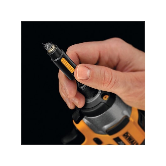 DEWALT DT7430-QZ, DT7430 drill accessory in hand. Photography product, close-up view, yellow and black details.