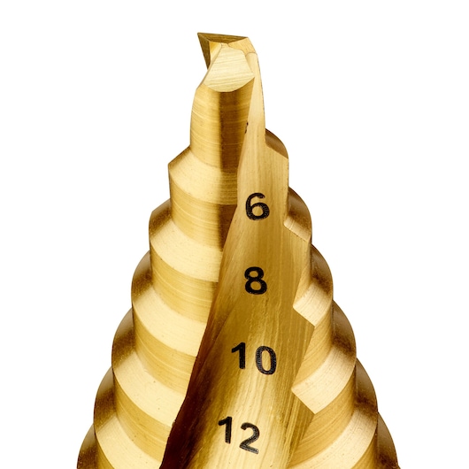 Close-up of a gold DEWALT step drill bit with visible engraved size markings 6, 8, 10, and 12.