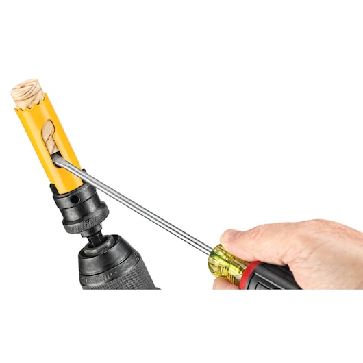 DEWALT DT90298, DT90298-QZ hole saw in drill, wood plug removed by screwdriver. Photography product.
