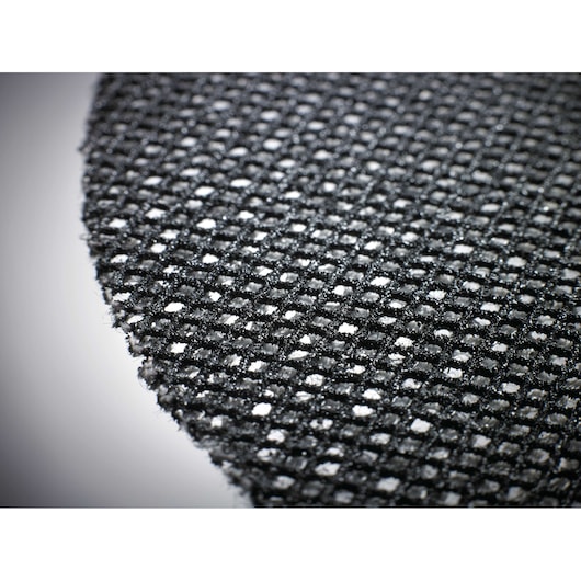 Close-up of a round, black mesh sanding pad with abrasive grit, shown in detail.