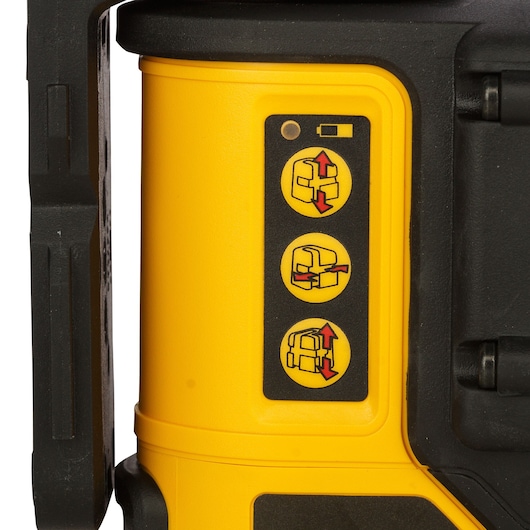 Close-up of Dewalt DW089K with operating symbols on a yellow panel, black edge visible, photography category.