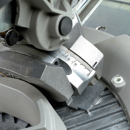Close-up of DEWALT DW743N saw angle adjustment scale with visible measurements.