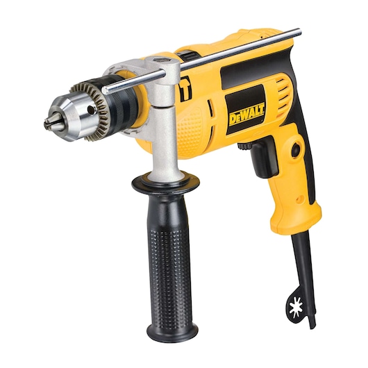 A yellow and black DEWALT electric drill with a side handle and a metal chuck key attached.