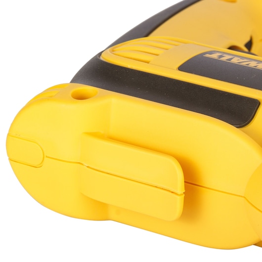 Close-up of a yellow DEWALT tool handle with a belt clip attachment visible.