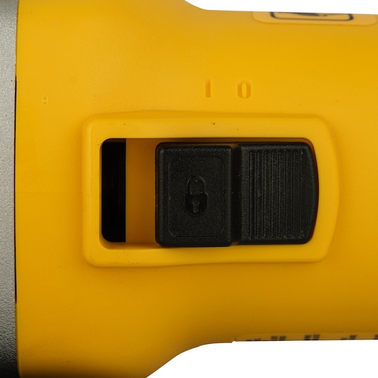 Close-up of a DEWALT yellow tool handle showing a black safety lock switch.