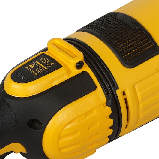 Close-up of a yellow and black DEWALT power tool handle with ventilation and control panel visible.