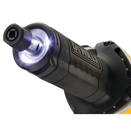 Close-up of a DEWALT power tool, showing its front section with an illuminated LED light at the tip and the DEWALT logo on the side.