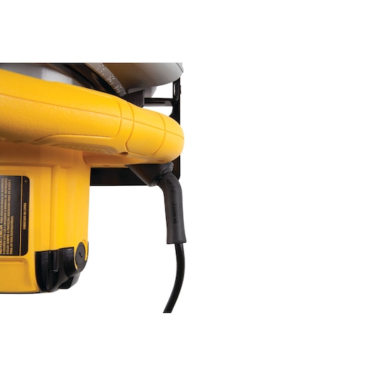 Close-up of yellow DEWALT DWE560 circular saw handle and power cord connection.
