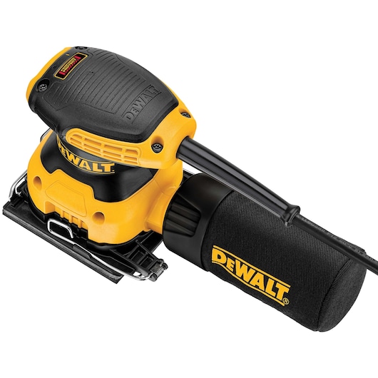 A close-up photo of a DEWALT electric sander with a black dust bag and yellow-and-black body, showing the brand logo clearly.