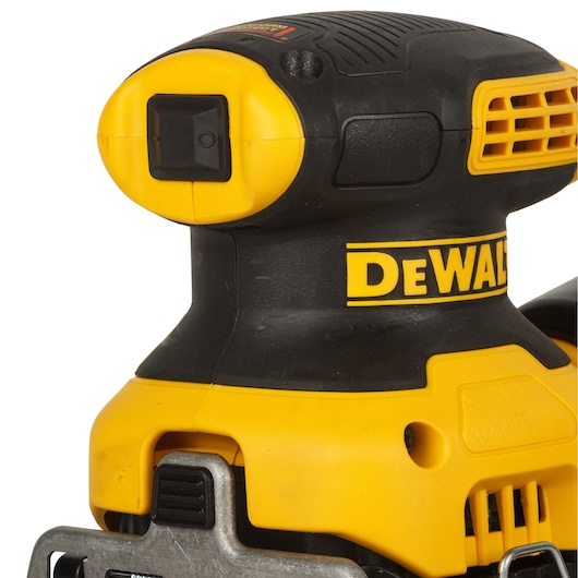 Close-up view of a yellow and black DEWALT power tool component, showing a cylindrical attachment with a rubber seal and detailed metal parts.