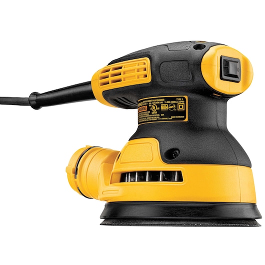A DEWALT electric palm sander with a yellow and black body, shown from a side angle. The sander features a circular sanding pad at its base and a dust collection port attached to the back.