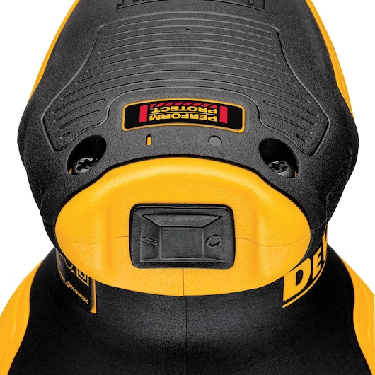 Close-up of a DEWALT DWE6423 power tool, showing its yellow and black body and the switch on the front.