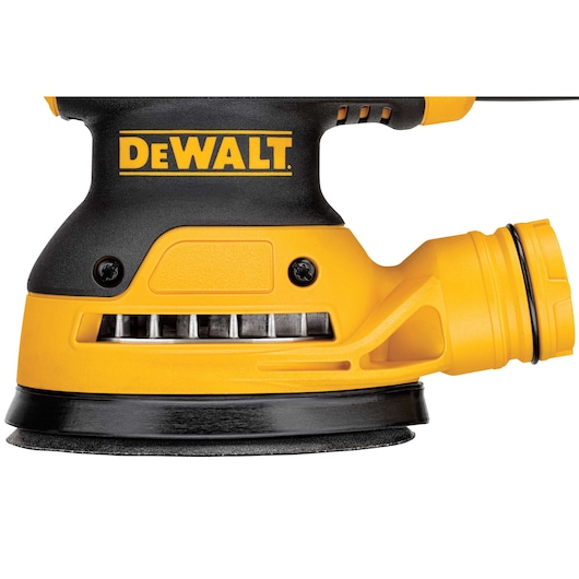 Close-up image of a DEWALT DWE6423 random orbital sander in black and yellow color. The sander shows its brand name prominently and features a dust extraction port.