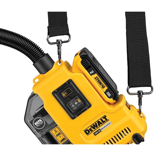 DEWALT DWH161D1 cordless HEPA dust extractor with shoulder strap and detachable battery, close-up view.