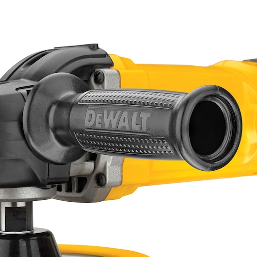 Close-up view of a DEWALT power tool handle, featuring textured grip and yellow housing.