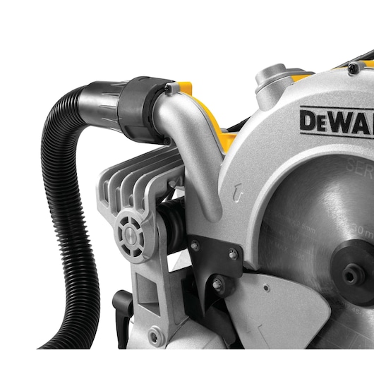 Close-up of a DEWALT mitre saw blade and dust extraction hose attachment.