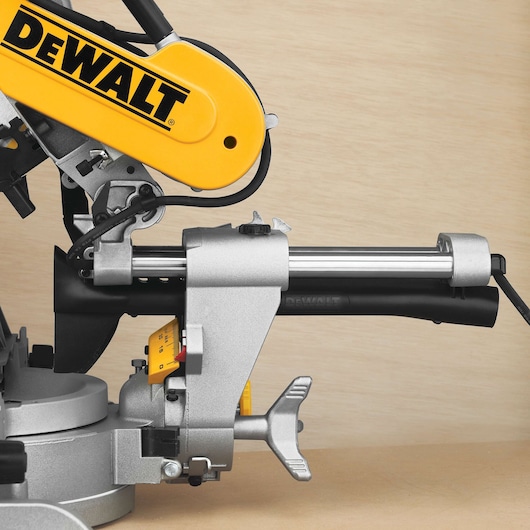 Close view of DEWALT DWS780, DWS780KIT saw, photography category product. Visible branded yellow and metal parts.